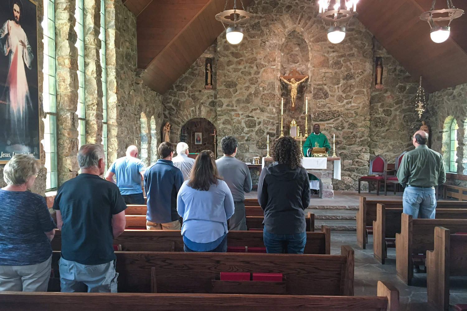 Visitors attend Mass in the Chapel on the Rock, formally named St. Catherine of Siena Chapel in Allenspark, Colorado, near Estes Park, is seen June 19, 2019. The chapel is on the grounds of the Camp St. Malo Retreat Center, which was made famous during St. John Paul II’s epic World Youth Day visit to the Denver in 1993.